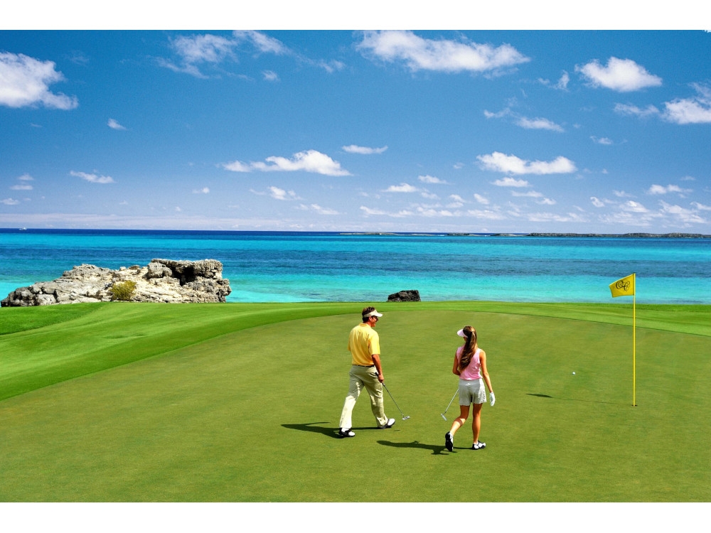 couple walking on golf course